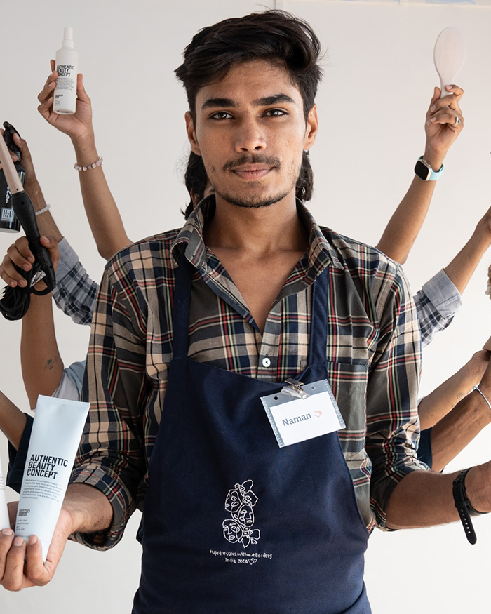 Indischer Friseur mit Produkten von ABC für Authentic Beauty Concept Hairdressers Without Borders